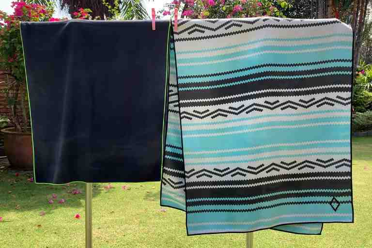 Having different colored towels can be important when you need multiple towels for multiple purposes. For example, you may have different towels for showering, for lounging at the beach, for drying your pets off, etc. 
Some brands also tend to have colors that bleed more than others.
If color is important to you, I highly recommend towels from Nomadix. My Nomadix Original Towel is beautifully designed with vibrant colors. When I washed it for the first time, I was pleasantly surprised to find that there was no bleeding, at all. And after months of using and washing it, the color never faded. 

