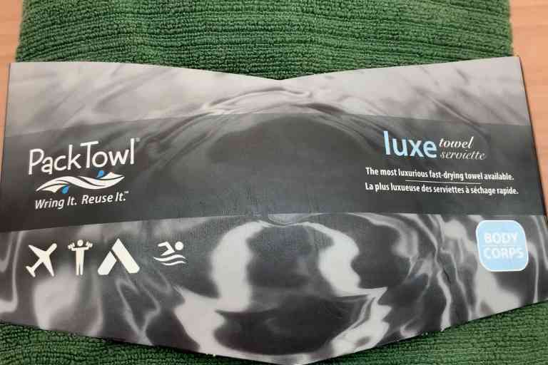The front packaging of the PackTowl Luxe.