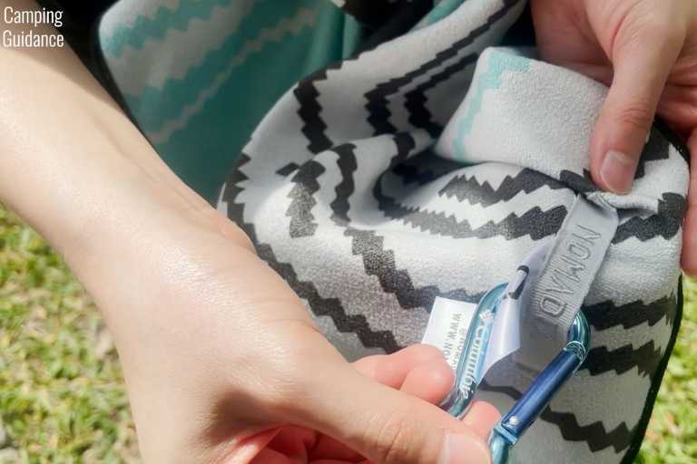 For fixed hanging loops like the Nomadix Towel's, you'd need a separate carabiner.