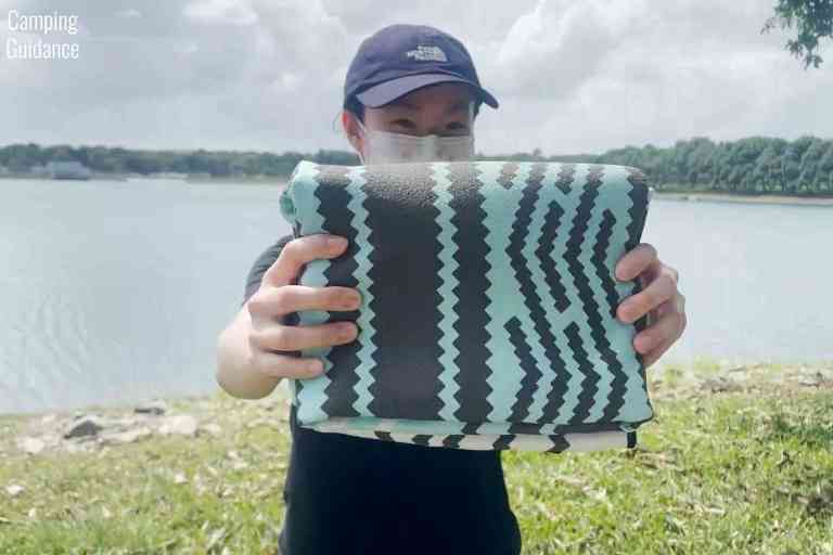 The Nomadix Original towel folded up; it's compact for such a large Beach-sized towel.