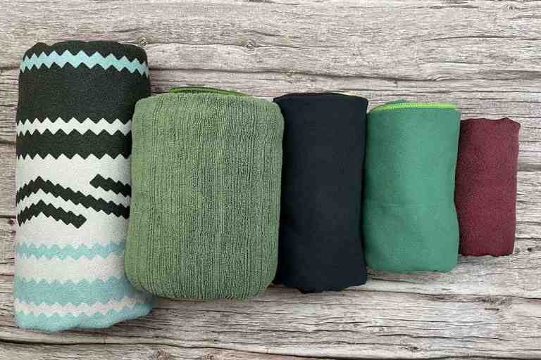 My best camping towels from the left: Nomadix Towel, PackTowl Luxe, PackTowl Personal, Wise Owl Outfitters Towel, and the Matador Nanodry towel.