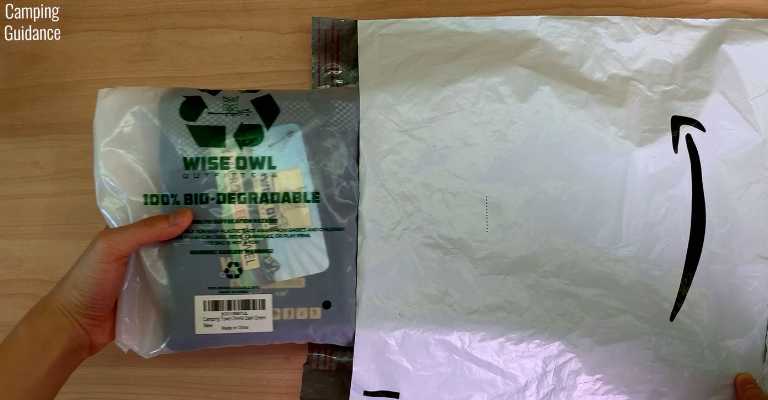 Removing the Wise Owl Towel (still in plastic packaging) from the Amazon package.