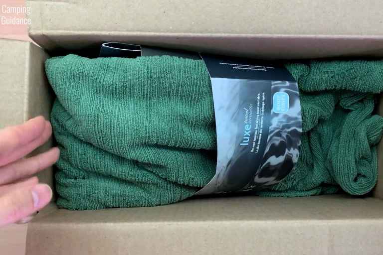 The PackTowl Luxe in a cardboard box from REI Co-Op.
