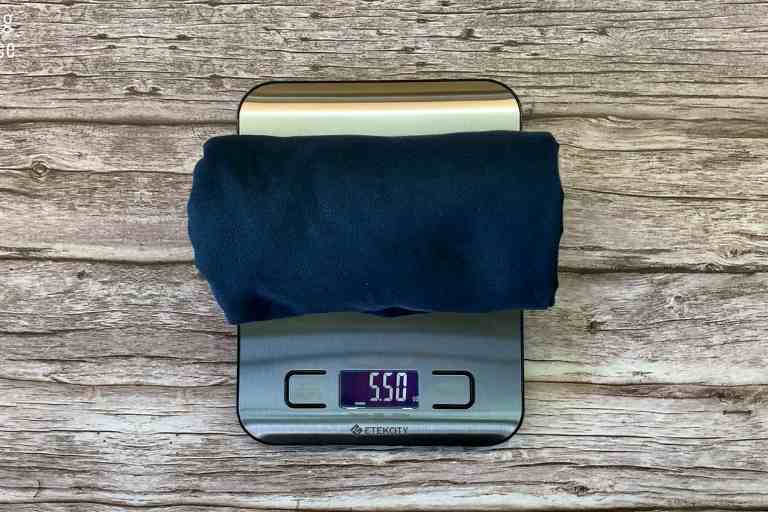 Weighing the Rainleaf Microfiber towel on a weighing scale, in ounces - 5.5 ounces.