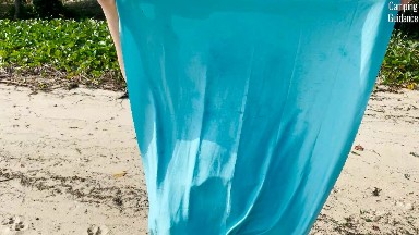 Sand stuck to the Sea to Summit AirLite Towel.