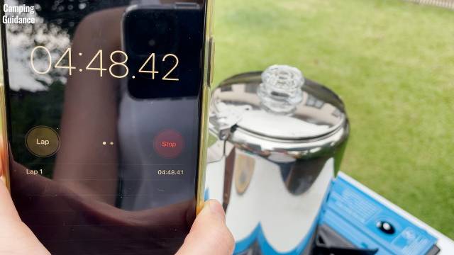 Timing how long it takes for the water to boil in the Coletti Bozeman Camping Coffee Percolator.