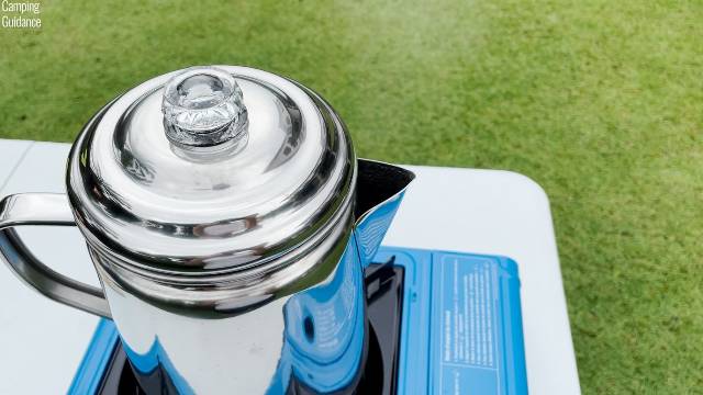 Steam coming out of the spout of the Coleman 12-Cup Stainless Steel Percolator.