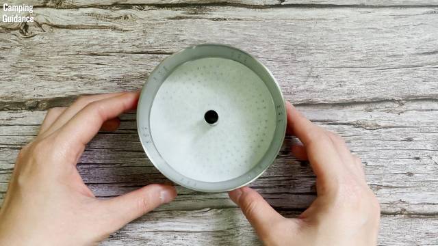 Using the provided coffee filter paper that came with the Coletti Bozeman Camping Coffee Percolator.