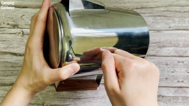 The stainless steel of the Coletti Bozeman Camping Coffee Percolator’s coffee pot.