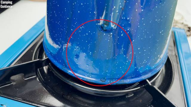 Coffee splatters on the Stansport Enamel 8-Cup Percolator after some boiling over.