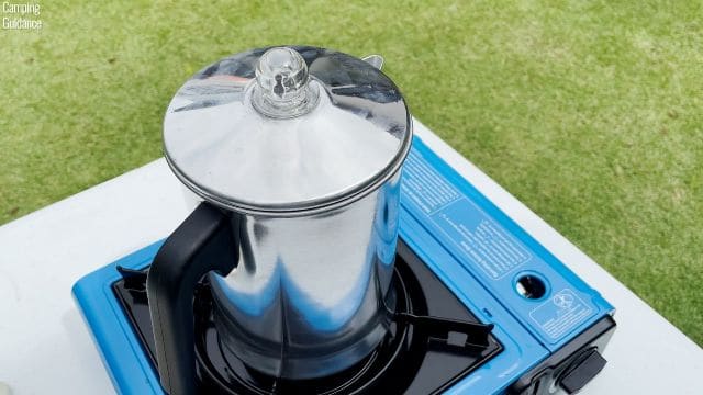 The Primula Today Aluminum 9-Cup Percolator on a Coleman Portable Butane Stove.