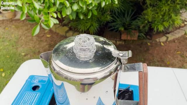 The Coletti Bozeman Camping Coffee Percolator on top of a Coleman Portable Butane Stove.