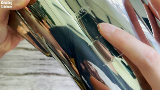 The water level markings on the outside of the Coletti Bozeman Camping Coffee Percolator.