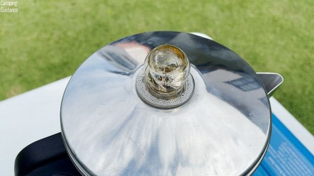 Coffee perking in the perk knob of the Primula Today Aluminum 9-Cup Percolator.