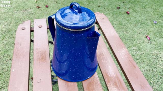 I placed the Stansport Enamel 8-Cup Percolator on a table outdoors.