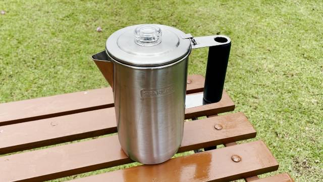 I placed the Stanley Camp Percolator on a table outdoors.
