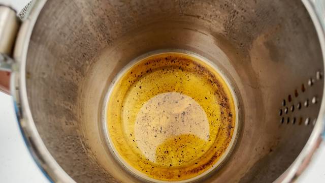 Minimal grounds in the last cup of the Coletti Bozeman Camping Percolator after letting it rest for a few minutes.