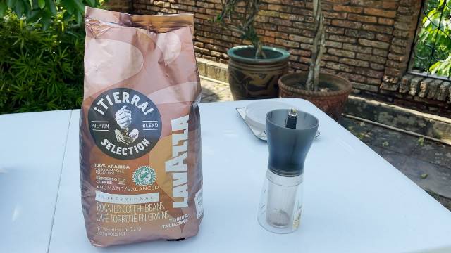 I bought Lavazza whole bean medium roast coffee (left), and used a Hario Mini Mill Hand Grinder to get a coarse grind.