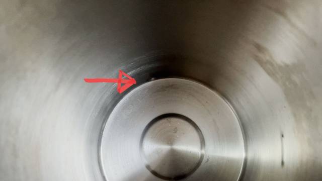 A dent in the base of the Stanley Camp Percolator.