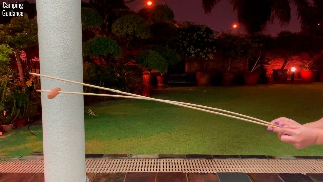 Here’s how much the bamboo marshmallow roasting sticks flexed with just 1 hot dog on it.