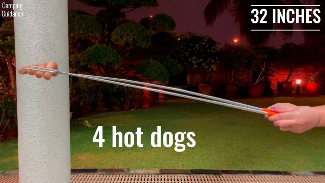 Here’s how much the Briout Marshmallow Roasting Sticks flexed with 4 hot dogs on it at a length of 32 inches.