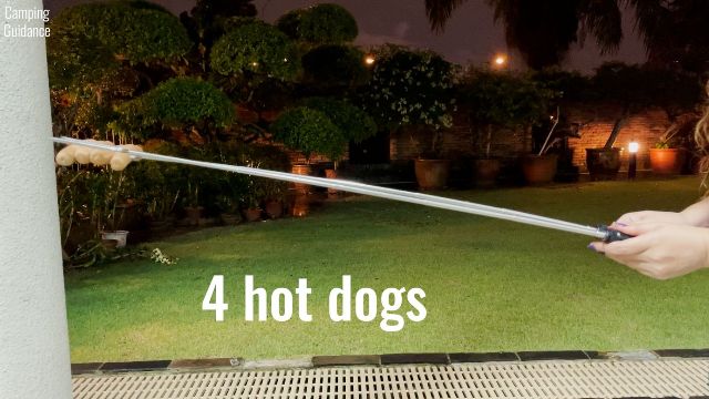 Here’s how much the Sumpri Marshmallow Roasting Sticks flexed with 4 hot dogs on it.