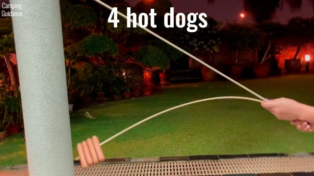 Here’s how much the bamboo marshmallow roasting sticks flexed with 4 hot dogs on it.
