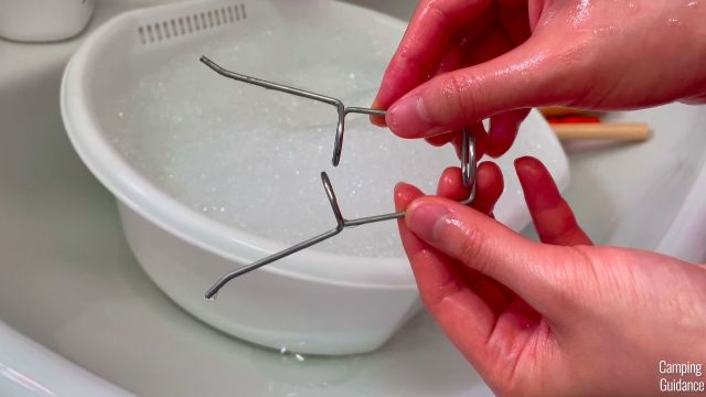 This is a photo of me washing my Light my Fire GrandPa's FireFork.