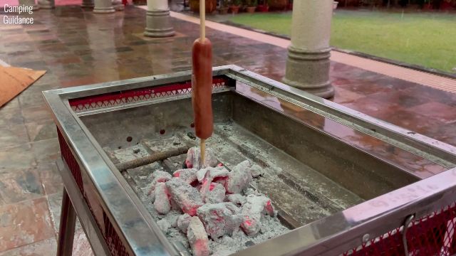 Here's a photo of me roasting hot dogs (downwards facing the fire) with the bamboo marshmallow roasting sticks, and I skewered the hot dog vertically instead of horizontally.