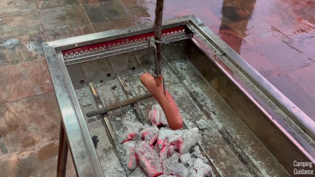 Here's a photo of me roasting a hot dog downwards facing the fire with the Light my Fire GrandPa's FireFork. I'm testing to see whether it'll fall off.