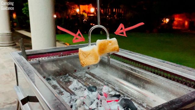 Here's a photo of me roasting marshmallows with the Sumpri Marshmallow Roasting Sticks and hanging them downwards.