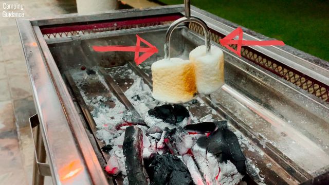 Here's a photo of me roasting marshmallows with the Carpathen Campfire Roasting Sticks and hanging them downwards. You can see slipping of the marshmallows from the traces of marshmallow goo.