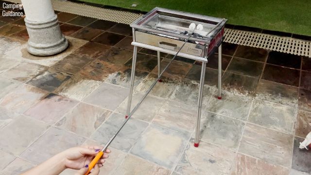 Here’s a photo of me using the Briout Marshmallow Roasting Sticks to roast marshmallows at a distance of 45 inches from the Coleman barbecue pit.