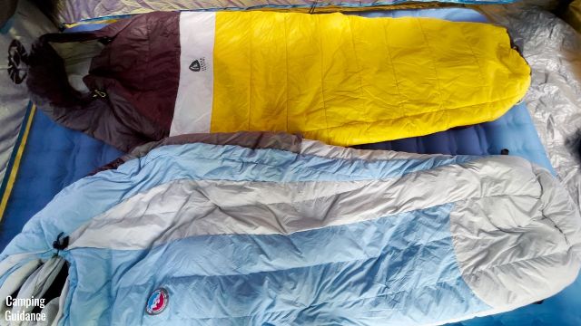 This is a picture of 2 sleeping bags on top of the Alps Mountaineering Vertex Air Bed (Queen).
