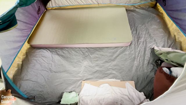 This is a picture of the Exped MegaMat Duo 10 (placed horizontally) inside a Coleman 4-Person Dome Tent.