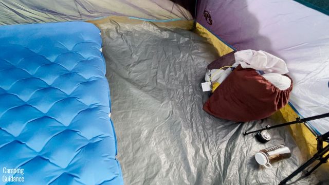 This picture shows the Sierra Designs 2-Person Camping Air Mattress inside a Coleman 4-Person Dome Tent.