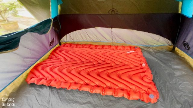 This is a Klymit Double V Insulated Sleeping Pad placed horizontally inside a Coleman 4-Person Dome Tent.
