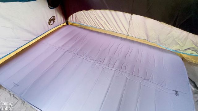 This is a picture of the REI Camp Dreamer Double inside a tent. It has dimensions of 81 by 54 inches.