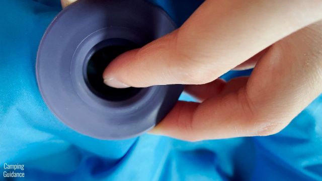 This is a picture of me pressing on the in-built flap of the Inflate valve of the Klymit Double V Uninsulated Sleeping Pad to let out a bit of air.