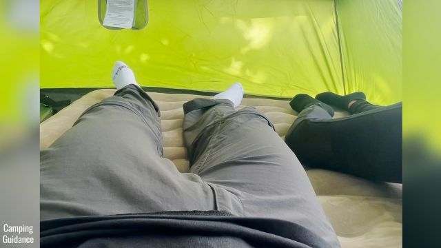 This is a picture of 2 people on top of the Etekcity Upgraded Camping Air Mattress in a Queen size.