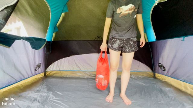 This is a picture of me using the handle to carry around the Klymit Double V Insulated Sleeping Pad.