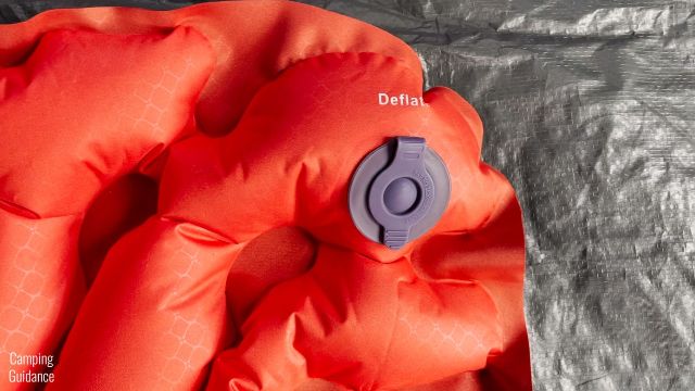 This is a picture of the Deflate valve (closed) of the Klymit Double V Insulated Sleeping Pad.