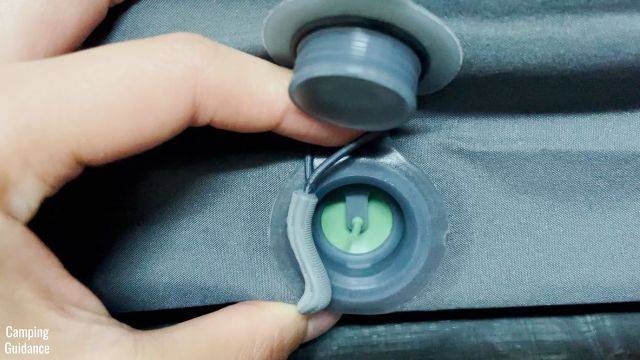 This is a picture of the Inflation valve of the Exped MegaMat Duo 10, which comes with an attached toggle.
