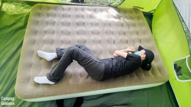 This is a picture of me lying down on the Etekcity Upgraded Camping Air Mattress.