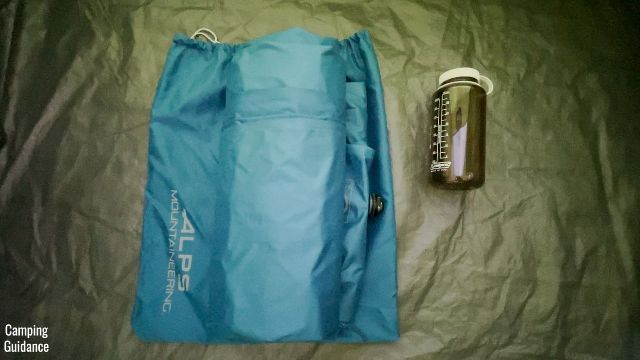 This is a picture of the packed-up Alps Mountaineering Vertex Air Bed beside a 32-ounce Nalgene bottle.