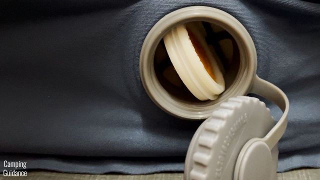 This is a picture of me positioning the valves of the REI Camp Dreamer Double sideways, to allow more air to flow in for a quick inflation.