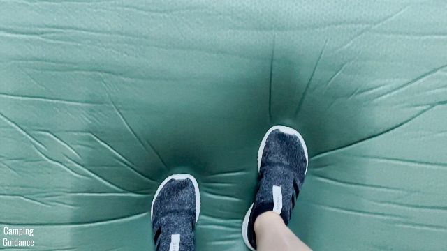 This is a picture of me stepping on my Exped MegaMat Duo 10.