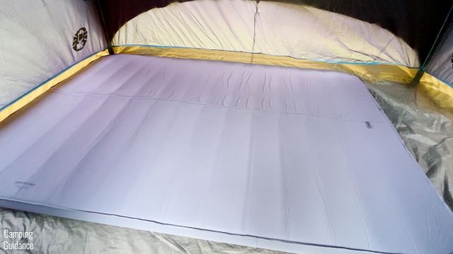 This is a picture of the REI Camp Dreamer Double inside a tent.