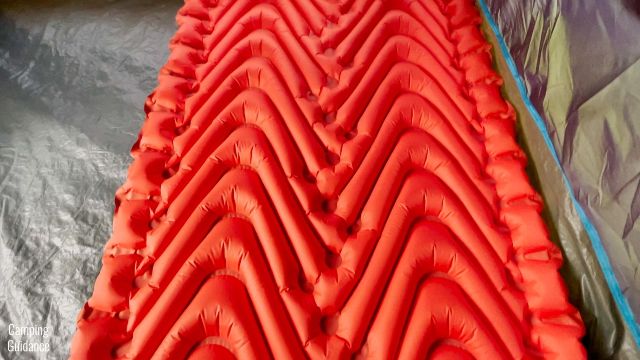 This is a picture of a Klymit Double V Insulated Sleeping Pad inside a tent.