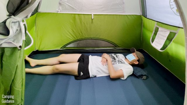 This is a picture of me using the REI Camp Dreamer Double's included pump as a pillow.